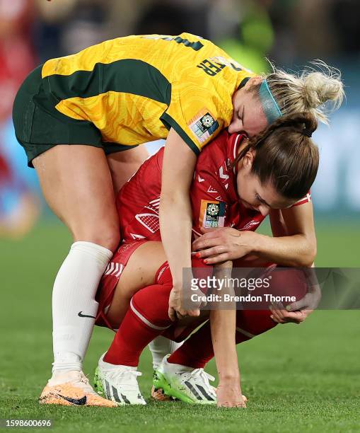 Ellie Carpenter of Australia consoles Signe Bruun of Denmark following the FIFA Women's World Cup Australia & New Zealand 2023 Round of 16 match...