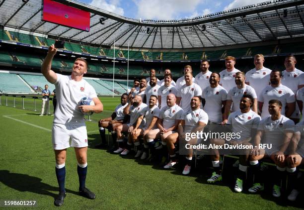 Owen Farrell of England takes a selfie during the England Rugby World Cup Squad Announcement at Twickenham Stadium on August 07, 2023 in London,...