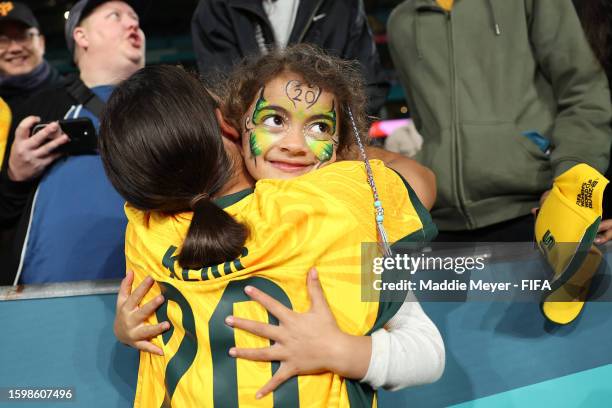 Sam Kerr of Australia embraces a young fan after the team’s 2-0 victory and advance to the quarter final following the FIFA Women's World Cup...