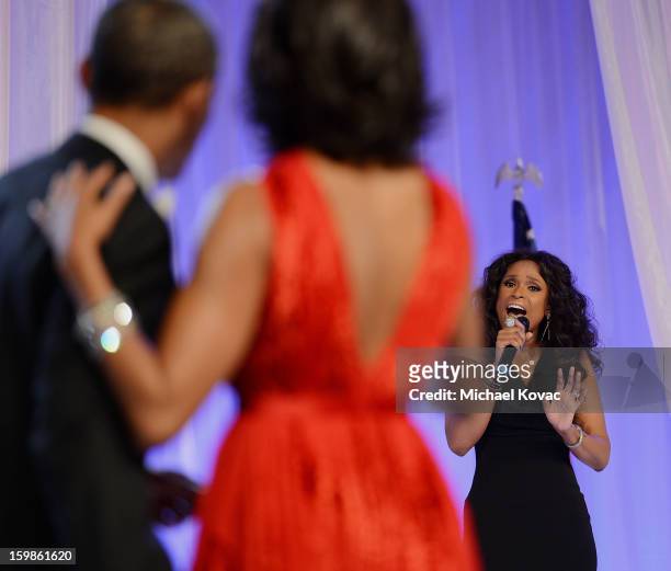 President Barack Obama and first lady Michelle Obama dance together during The Inaugural Ball as singer Jennifer Hudson performs at the Walter E....