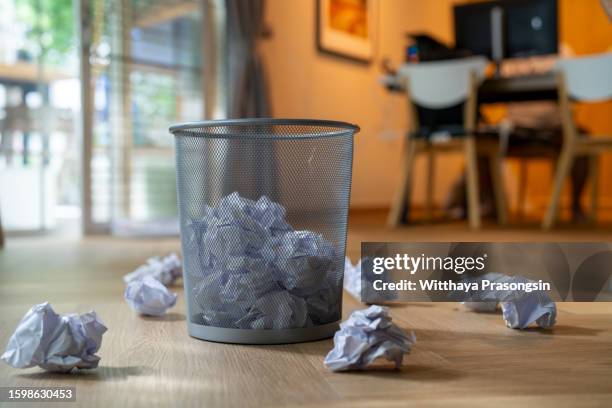 trash basket and paper ball - waste basket stock pictures, royalty-free photos & images