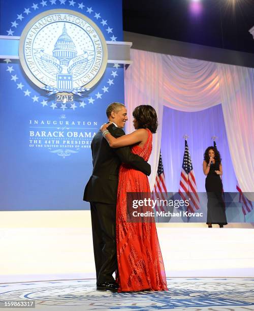 President Barack Obama and first lady Michelle Obama dance together during The Inaugural Ball as singer Jennifer Hudson performs at the Walter E....