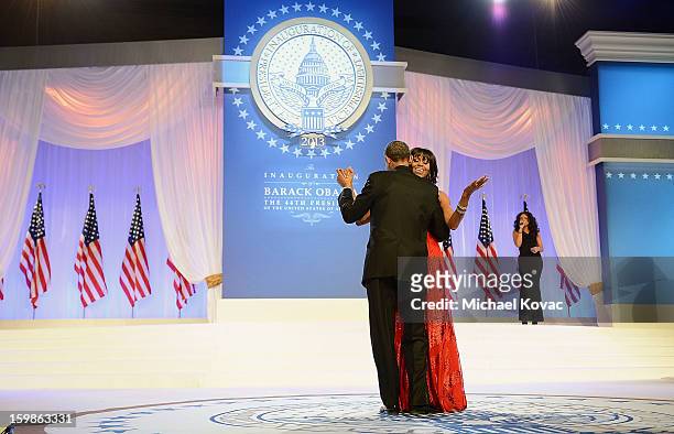 President Barack Obama and first lady Michelle Obama dance together during The Inaugural Ball as singer Jennifer Hudson performs at the Walter E....