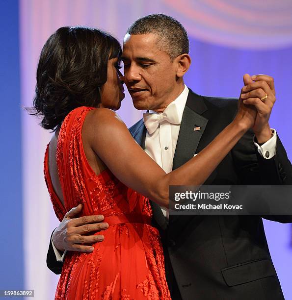 President Barack Obama and first lady Michelle Obama dance together during The Inaugural Ball at the Walter E. Washington Convention Center on...