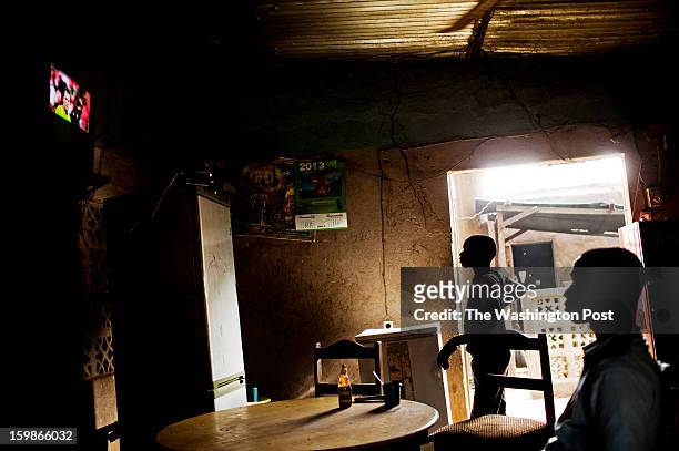 Residents of the town of Niono, near the frontline, watch a soccer match in the Africa Cup of Nations For the last week, French and Malian forces...