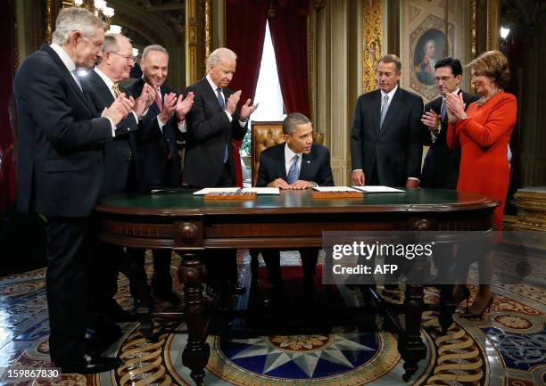 President Barack Obama is applauded by Senate Majority Leader Harry Reid ,D-NV, L-R: Senator Lamar Alexander ,R-TN, Senator Chuck Schumer ,D-NY, Vice...