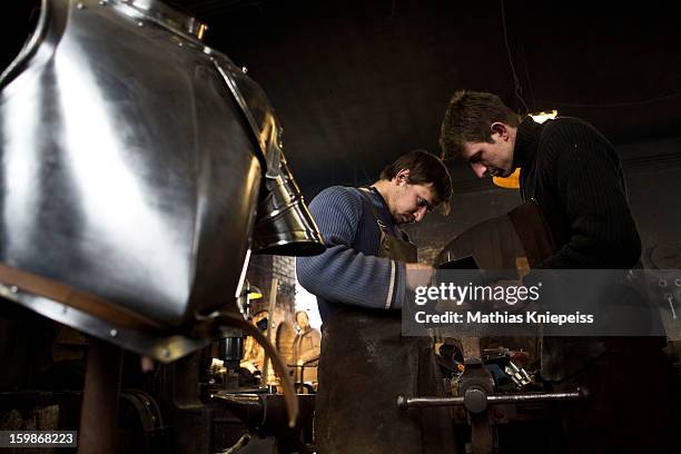 Blacksmith Georg Schmidberger and Johann Schmidberger Jun. Of the Schmiede Schmidberger blacksmiths crafts a piece of metal that will become part of...