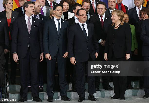 German Chancellor Angela Merkel and French President Francois Hollande, as well as French Minister of Industrial Renewal and German Economy Minister...