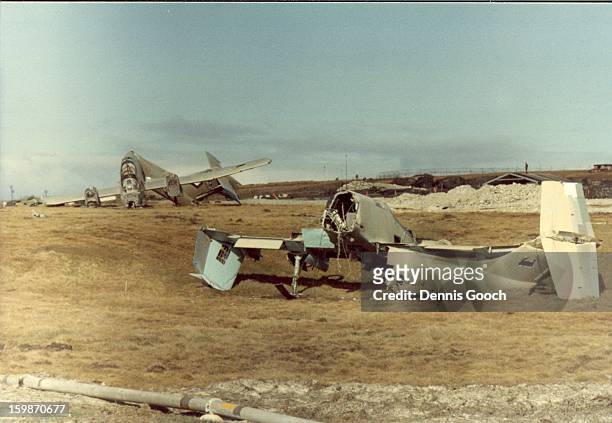 Residue of war at Stanley Airfield. October 1983. FMA Pucara. Closest aircraft is FMA Pucara A514.