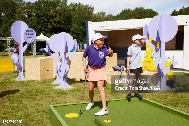 Local school children enjoy Golf.It in the Festival Village prior to the AIG Women's Open at Walton Heath Golf Club on August 07, 2023 in Tadworth,...