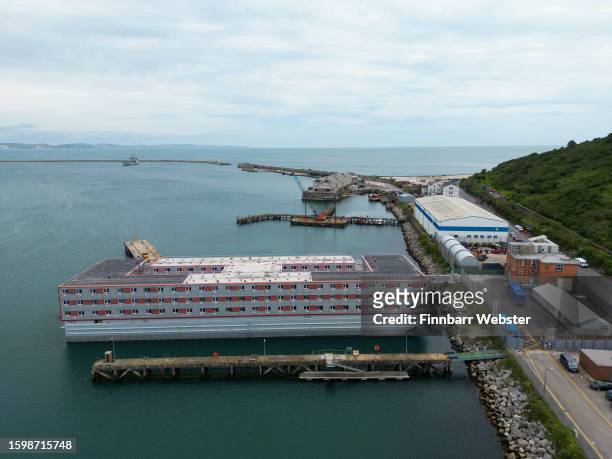 Aerial view of a coach at the Bibby Stockholm immigration barge, on August 07, 2023 in Portland, England. Approximately 50 arrivals are set to board...