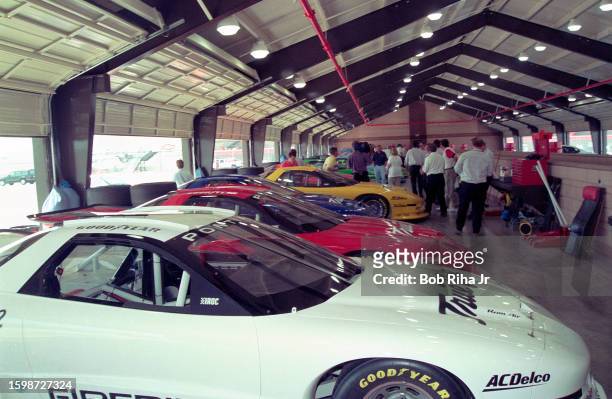 Pontiac Firebird Trans Am vehicles parked in garage after practice session on the recently opened California Speedway, June 17, 1997 in Fontana,...