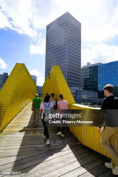People enjoy the Luchtsingel , a 400-meter-long pedestrian bridge that runs through a building and across roads and railways to connect three...