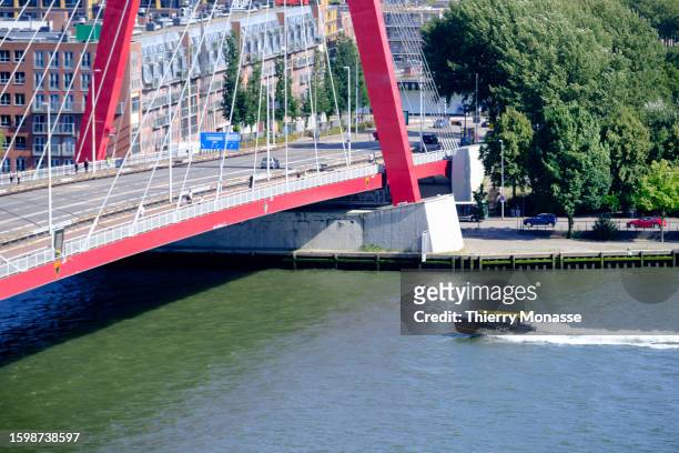 Water taxi sales on the Nieuwe Maas, under the Willemsbrug, on August 12, 2023 in Rotterdam, Netherlands. The fast water taxis can take passengers to...