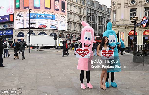 Lacey Banghard attends a photocall for PETA to encourage pet owners to have their cats and dogs sterilised at Picadilly Circus on January 22, 2013 in...