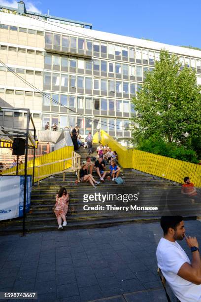 People Hangout in a biergarten at the end of the Luchtsingel , a 400-meter-long pedestrian bridge that runs through a building and across roads and...