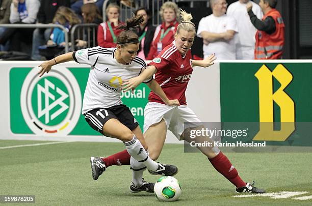 Jessica Wich of 1.FFC Frankfurt challenges Laura Stoerzel of SC 1907 Bad Neuenahr during the DFB Women's Indoor Cup 2013 at the GETEC-Arena on...