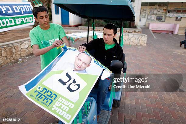 Israeli seporters of Naftali Bennett , head of HaBayit HaYehudi outside a polling station on election day on January 22, 2013 in the Jewish...