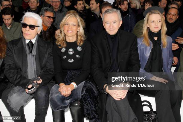 Karl Lagerfeld, Helene Arnault, Bernard Arnault, Chairman and CEO of LVMH Moet Hennessy - Louis Vuitton, and Delphine Arnault attend the Dior Homme...