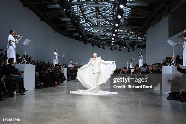 Model Carmen Dell'Orefice walks the runway during the Stephane Rolland Spring/Summer 2013 Haute-Couture show as part of Paris Fashion Week at Palais...