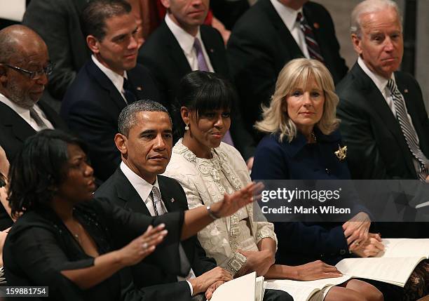 President Barack Obama, first lady Michelle Obama , Dr. Jill Biden and Vice President Joseph Biden , listen to Michele Fowlin direct the Children of...