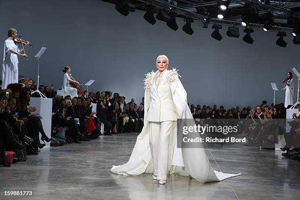 Model Carmen Dell'Orefice walks the runway during the Stephane Rolland Spring/Summer 2013 Haute-Couture show as part of Paris Fashion Week at Palais...