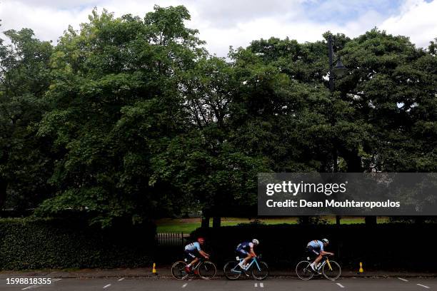 Tiesj Benoot of Belgium, Benoit Cosnefroy of France and Remco Evenepoel of Belgium compete in the 96th UCI Cycling World Championships Glasgow 2023,...