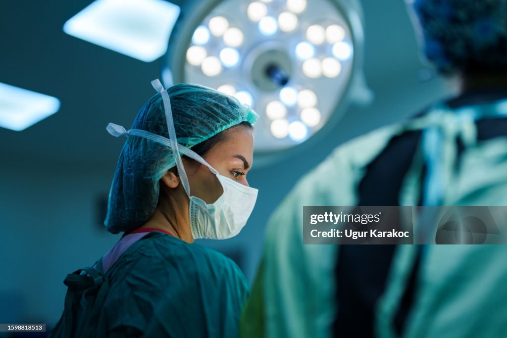 Surgeon and Nurses at Surgery Room
