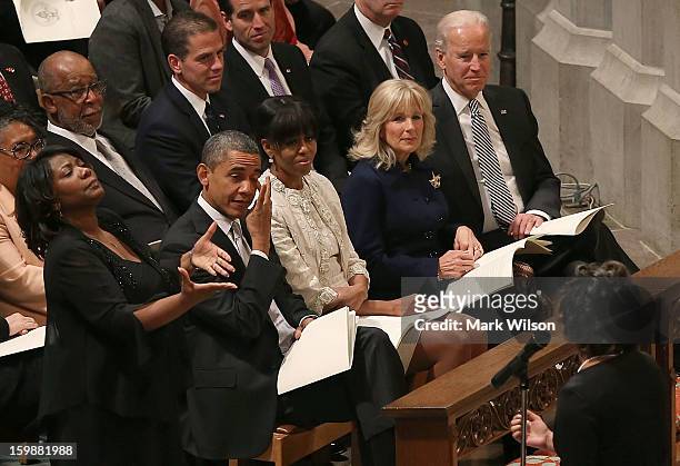 President Barack Obama wipes away a tear while he and first lady Michelle Obama , Dr. Jill Biden and Vice President Joseph Biden , listen to Michele...