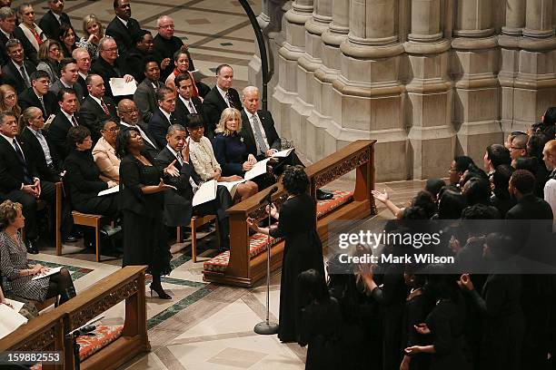 President Barack Obama wipes away a tear while he and first lady Michelle Obama , Dr. Jill BIden and Vice President Joseph Biden , listen to Michele...