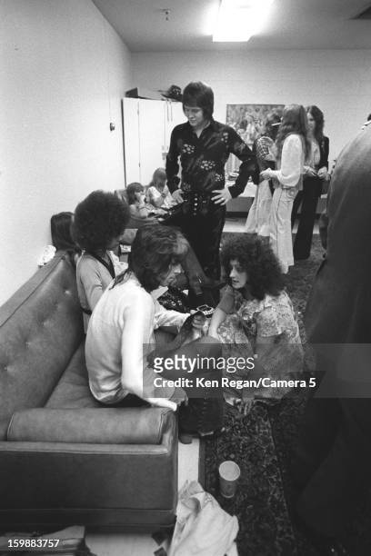 Keith Richards of the Rolling Stones is photographed backstage with friends in 1972 in Los Angeles, California. CREDIT MUST READ: Ken Regan/Camera 5...