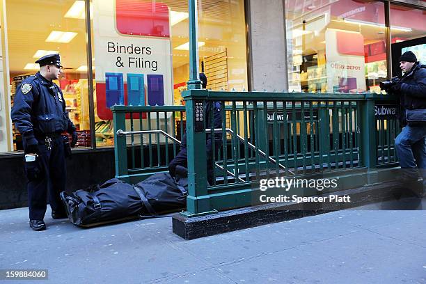 The body of an apparent suicide victim is brought up from a subway station in Times Square on January 22, 2013 in New York City. New York City has...