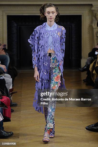 Model walks the runway during the Maurizio Galante show at Theatre du Chatelet on January 21, 2013 in Paris, France.