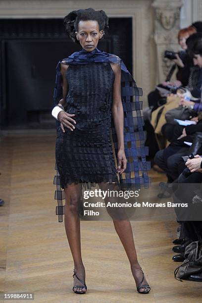 Model walks the runway during the Maurizio Galante show at Theatre du Chatelet on January 21, 2013 in Paris, France.