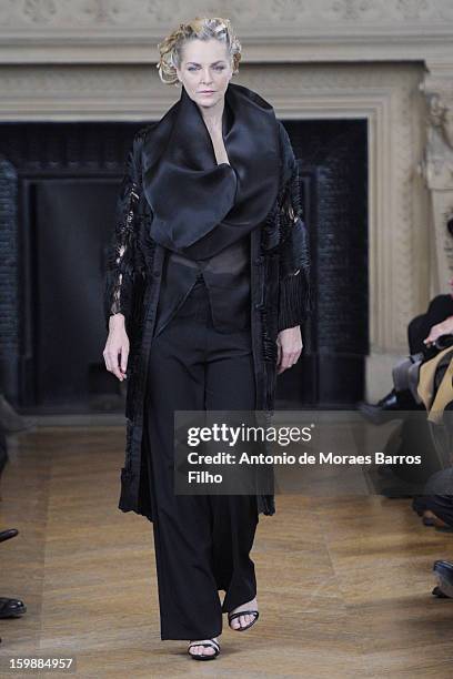 Model walks the runway during the Maurizio Galante show at Theatre du Chatelet on January 21, 2013 in Paris, France.