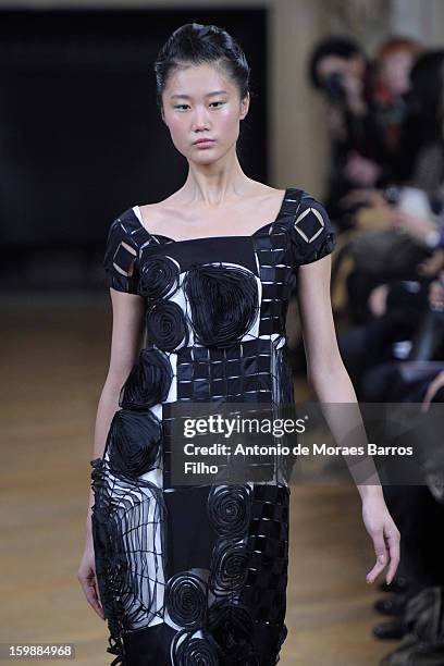 Model walks the runway during the Maurizio Galante show at Theatre du Chatelet on January 21, 2013 in Paris, France.