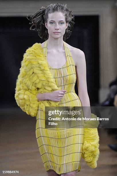 Model walks the runway during the Maurizio Galante show at Theatre du Chatelet on January 21, 2013 in Paris, France.