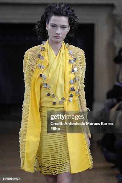 Model walks the runway during the Maurizio Galante show at Theatre du Chatelet on January 21, 2013 in Paris, France.