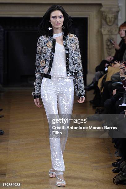 Model walks the runway during the Maurizio Galante show at Theatre du Chatelet on January 21, 2013 in Paris, France.