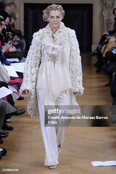 Model walks the runway during the Maurizio Galante show at Theatre du Chatelet on January 21, 2013 in Paris, France.