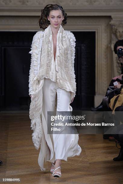 Model walks the runway during the Maurizio Galante show at Theatre du Chatelet on January 21, 2013 in Paris, France.