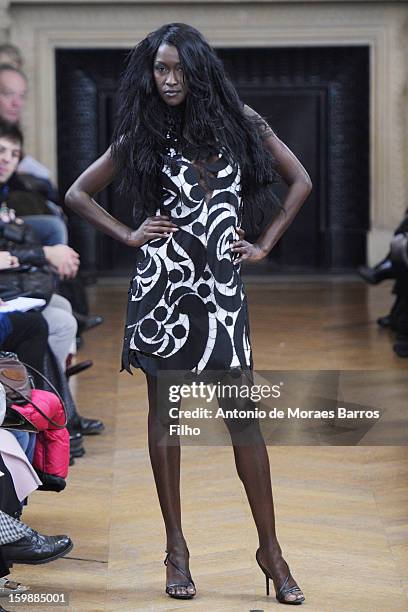 Model walks the runway during the Maurizio Galante show at Theatre du Chatelet on January 21, 2013 in Paris, France.