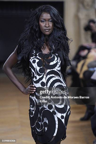 Model walks the runway during the Maurizio Galante show at Theatre du Chatelet on January 21, 2013 in Paris, France.