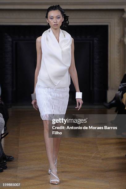 Model walks the runway during the Maurizio Galante show at Theatre du Chatelet on January 21, 2013 in Paris, France.