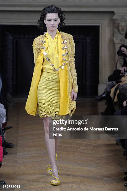 Model walks the runway during the Maurizio Galante show at Theatre du Chatelet on January 21, 2013 in Paris, France.