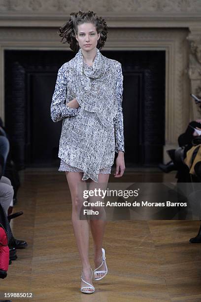 Model walks the runway during the Maurizio Galante show at Theatre du Chatelet on January 21, 2013 in Paris, France.