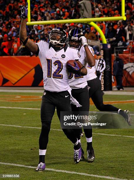 Jacoby Jones of the Baltimore Ravens celebrates after he scored a 70-yard touchdown reception in the fourth quarter against the Denver Broncos during...