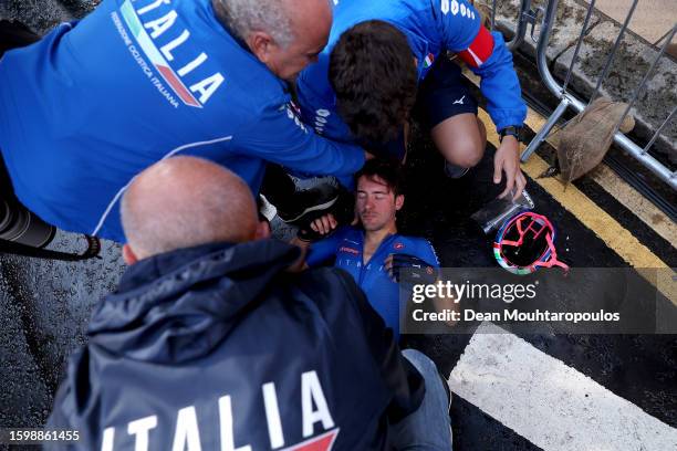 Alberto Bettiol of Italy is treated by his team after completing the 96th UCI Cycling World Championships Glasgow 2023, Men Elite Road Race a 271.1km...