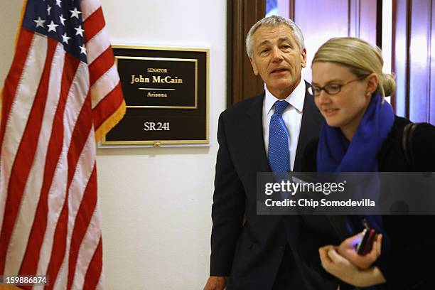 Accompanied by CIA Spokesperson Marie Harf , former U.S. Senator Chuck Hagel leaves the Capitol Hill offices of Sen. John McCain after the two...