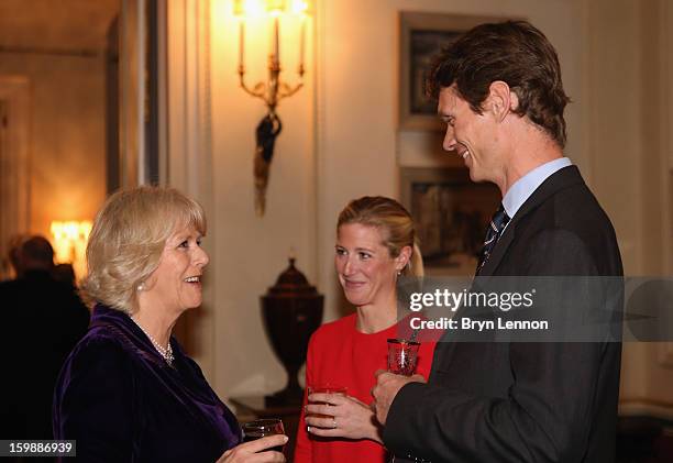 Camilla, Duchess of Cornwall chats to Laura Bechtolsheimer and William Fox-Pitt during a reception hosted by the Duchess of Cornwall for the British...